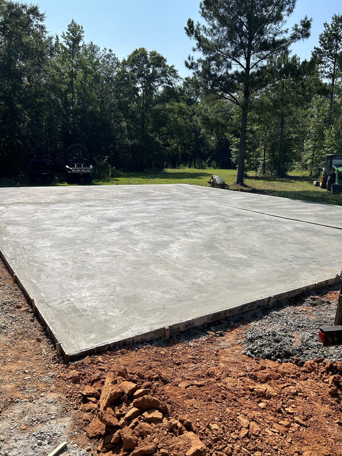 Large backyard slab finished concrete photo 1 Large backyard slab driveway and pad concrete project completed by Colquitt Concrete in Georgia