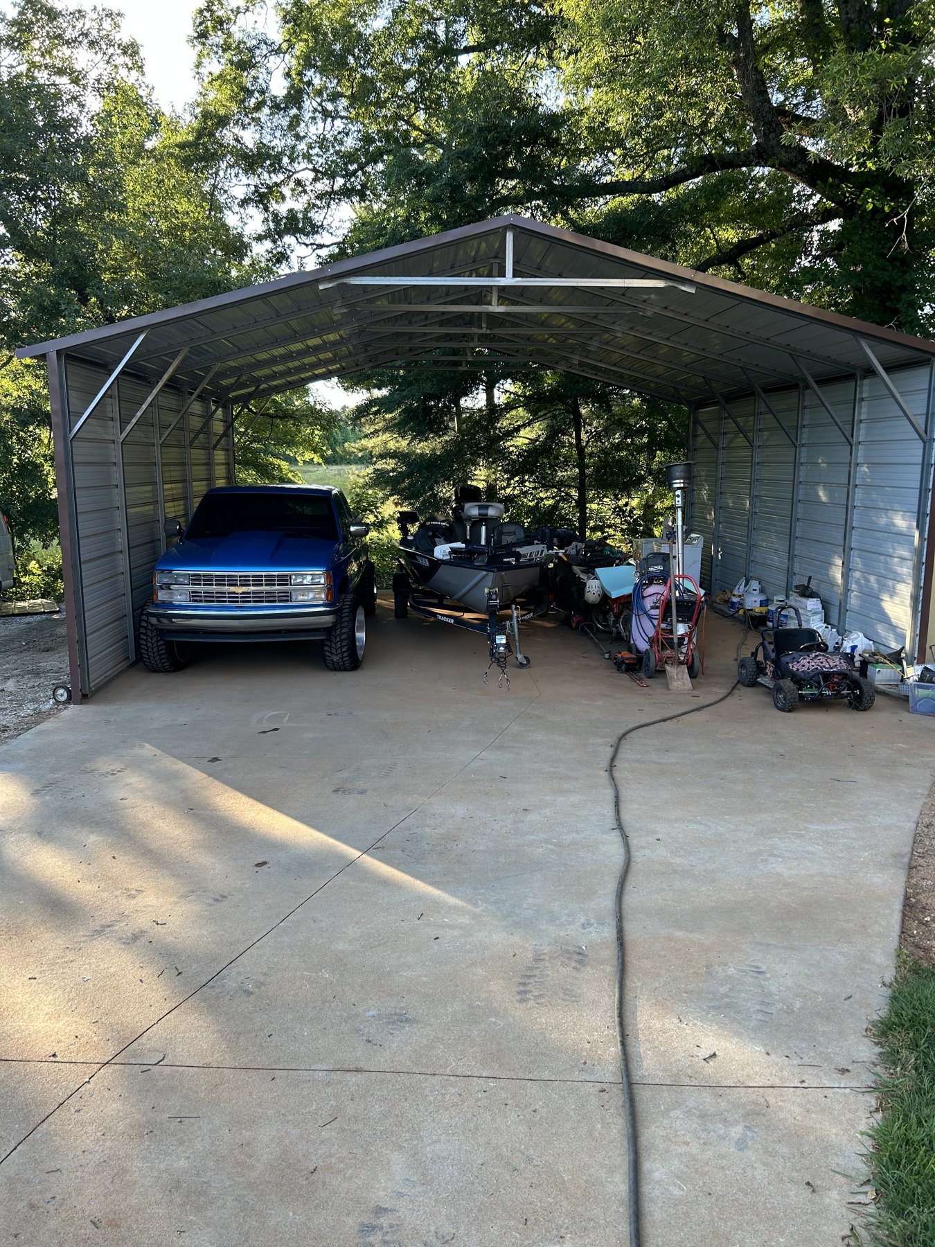 Large backyard slab finished concrete photo 5 Large backyard slab after photo 5 showing finished driveway and pad concrete work by Colquitt Concrete in Georgia