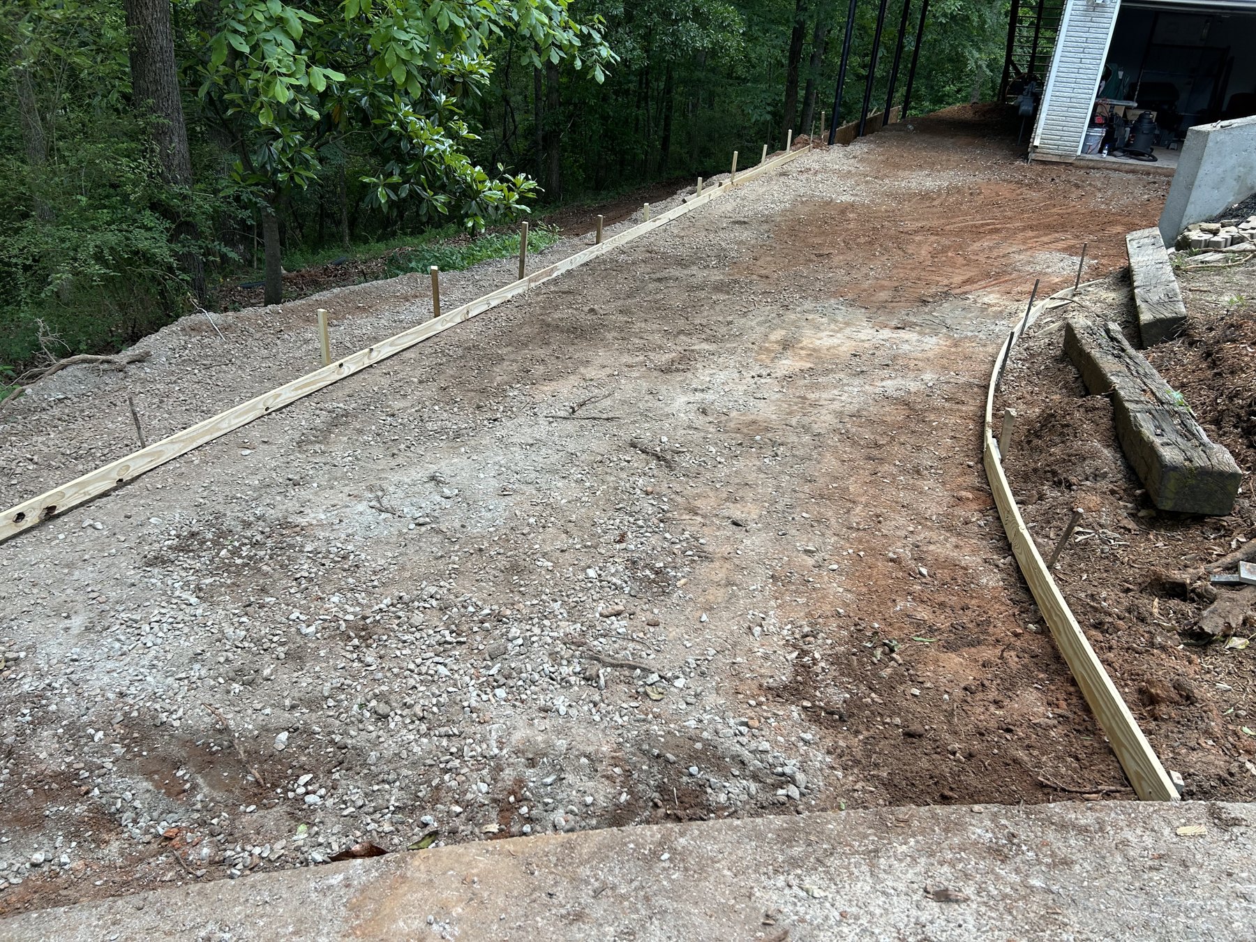 Large backyard slab before concrete work photo 1 Large backyard slab before photo 1 showing driveway and pad concrete preparation by Colquitt Concrete in Georgia