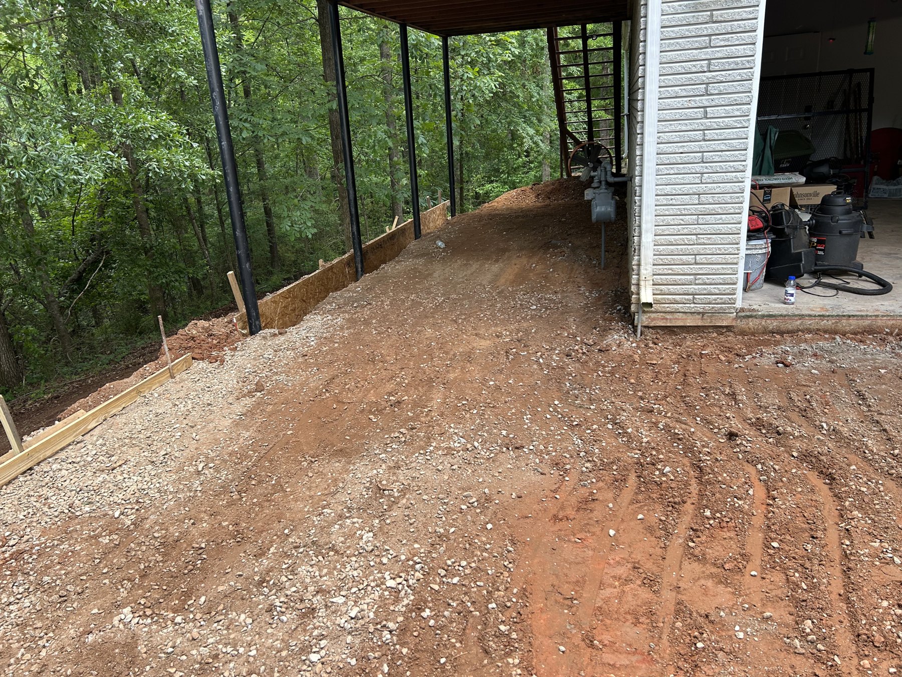 Large backyard slab before concrete work photo 2 Large backyard slab before photo 2 showing driveway and pad concrete preparation by Colquitt Concrete in Georgia