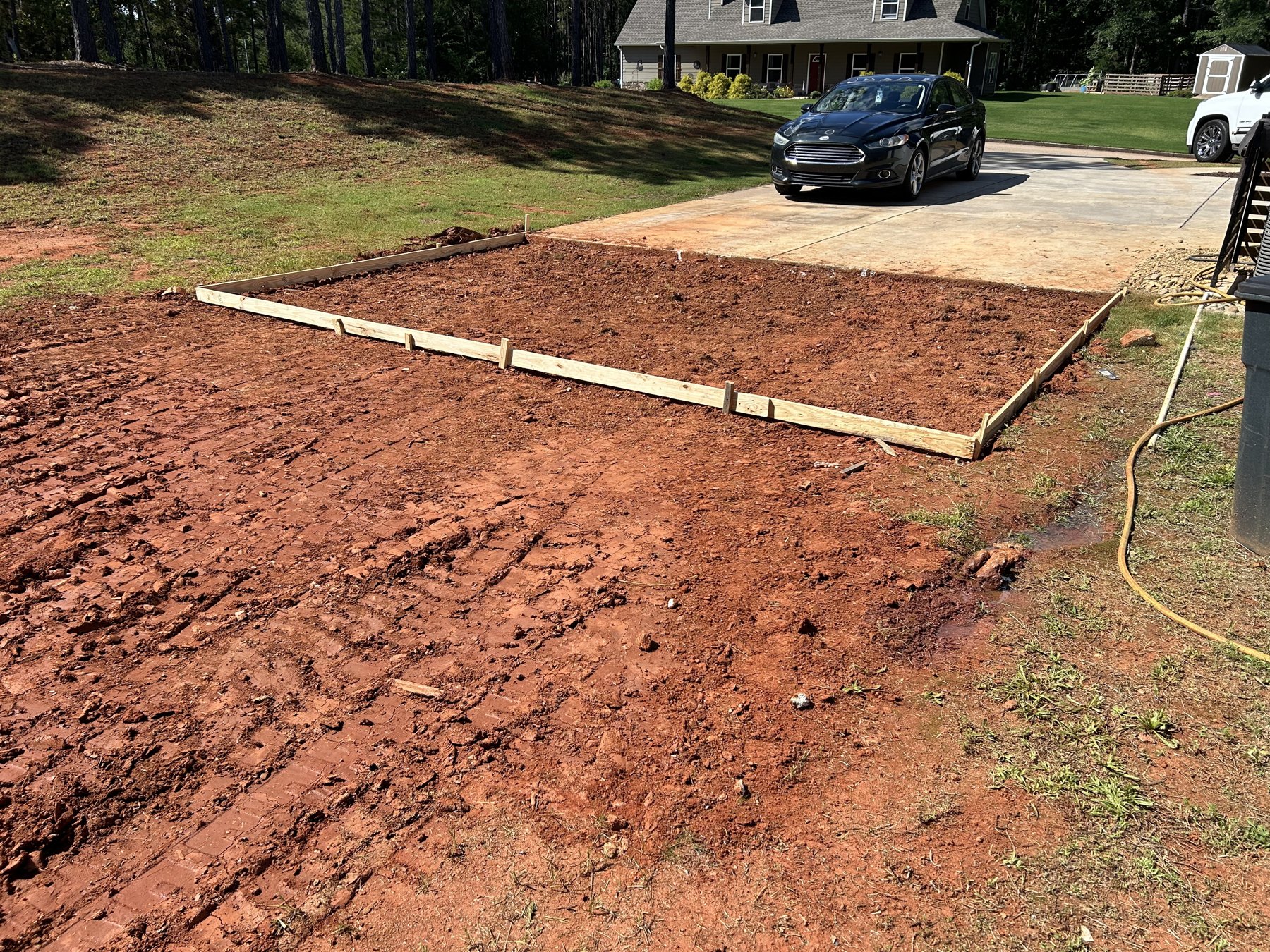 Large backyard slab before concrete work photo 5 Large backyard slab before photo 5 showing driveway and pad concrete preparation by Colquitt Concrete in Georgia