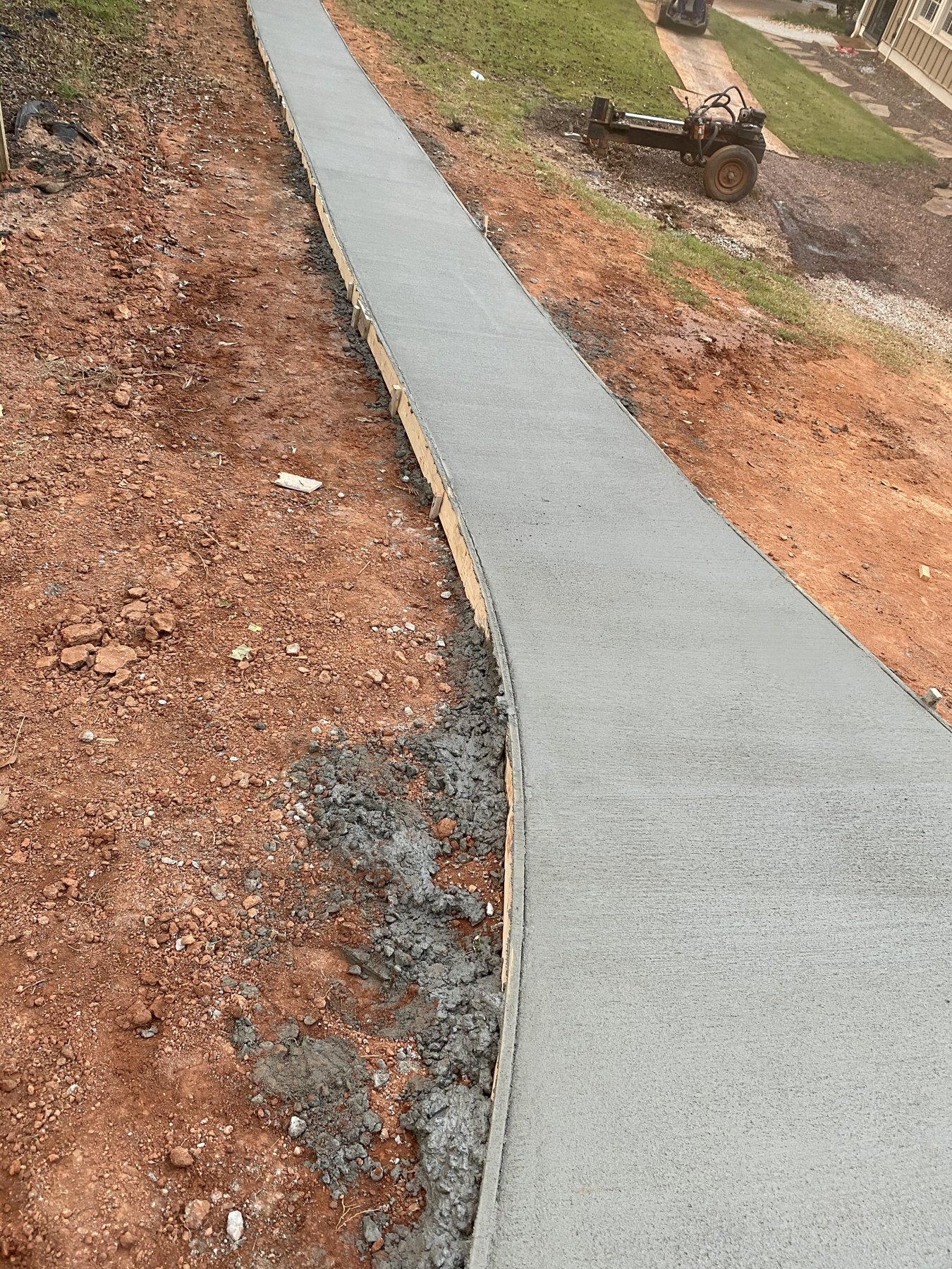 Curved walkway finished concrete photo 1 Curved walkway walkway concrete project completed by Colquitt Concrete in Georgia