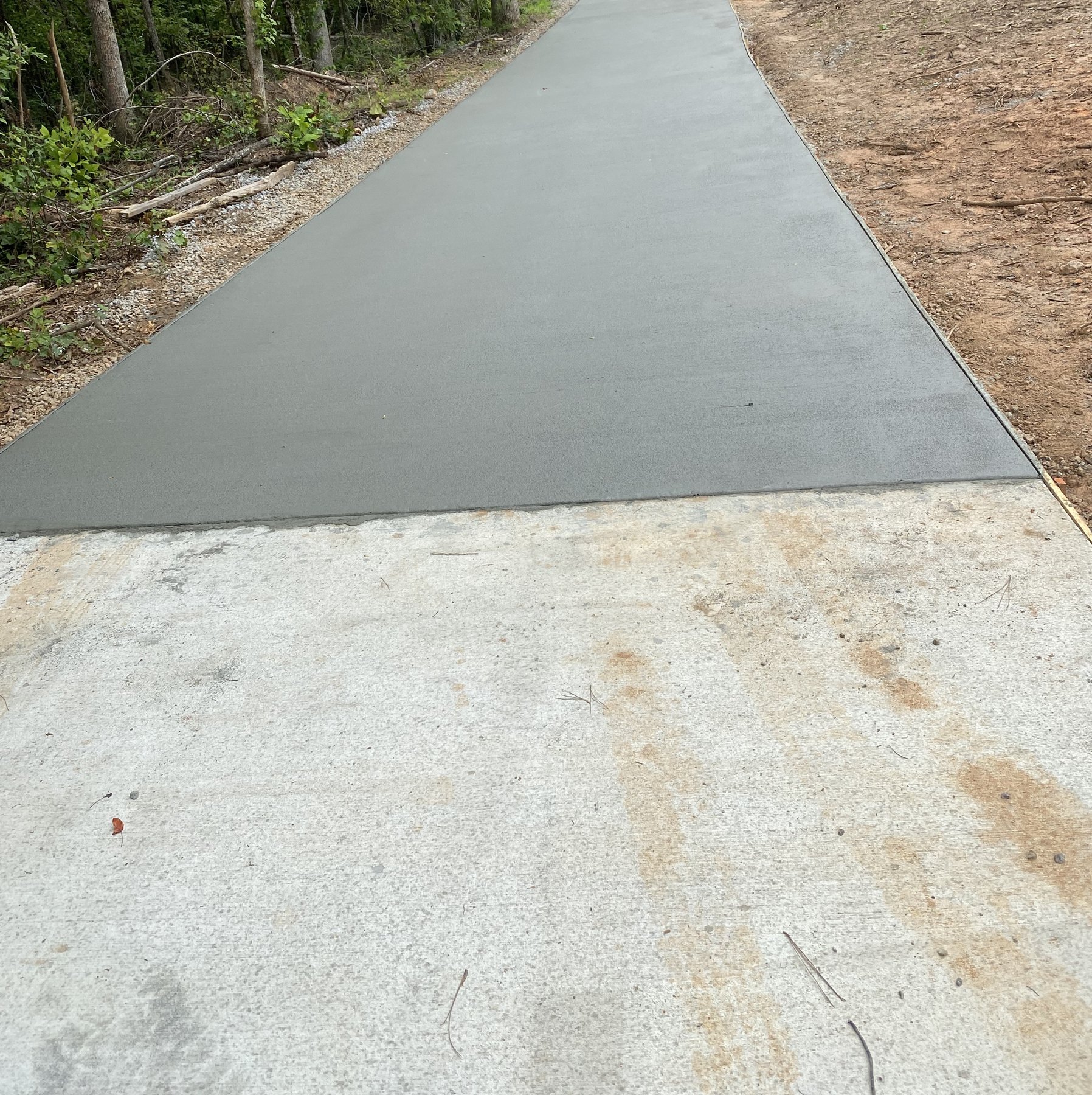 Curved walkway finished concrete photo 4 Curved walkway after photo 4 showing finished walkway concrete work by Colquitt Concrete in Georgia