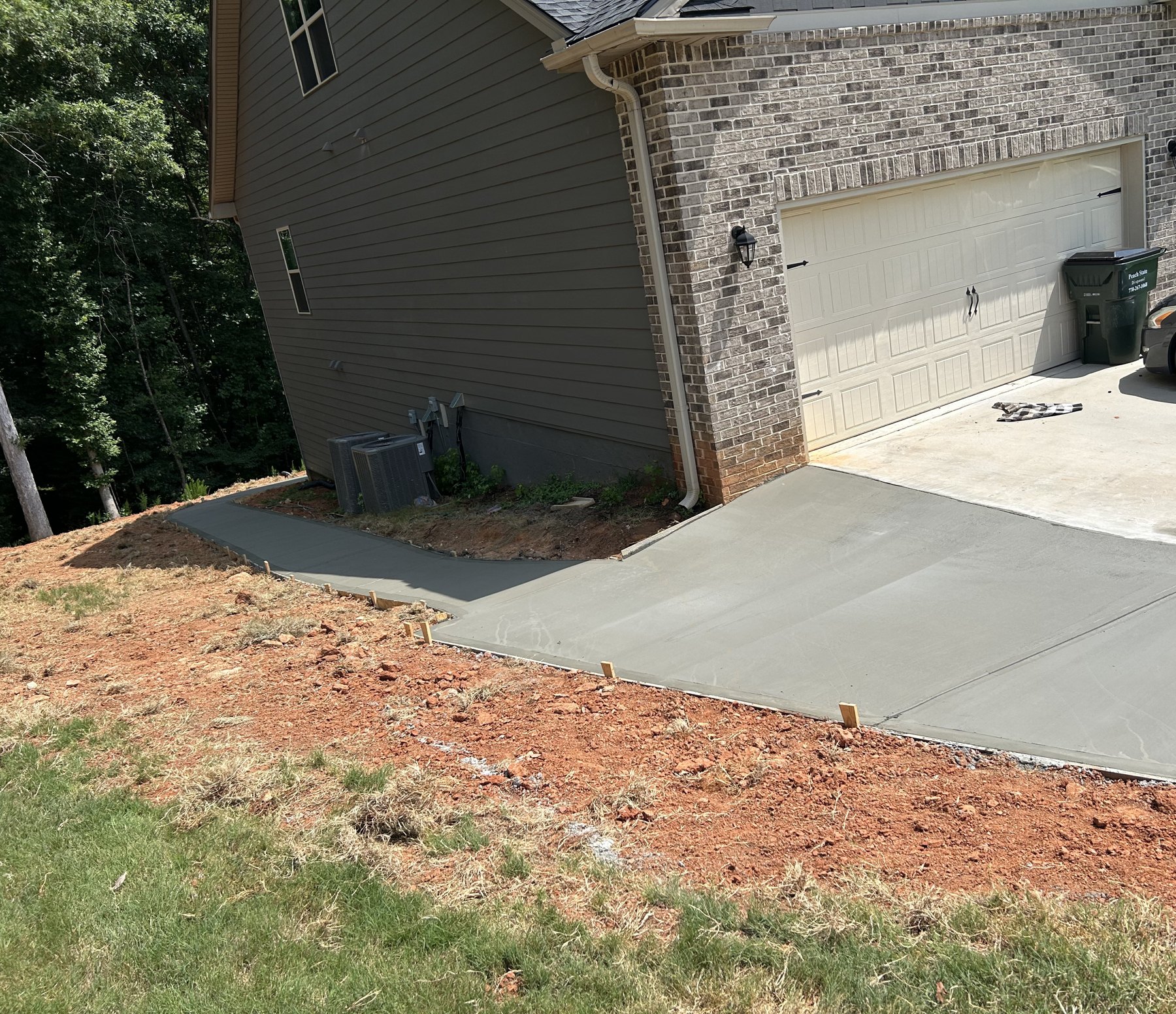 Garage walkway approach after photo 1 showing finished walkway concrete work by Colquitt Concrete in Georgia