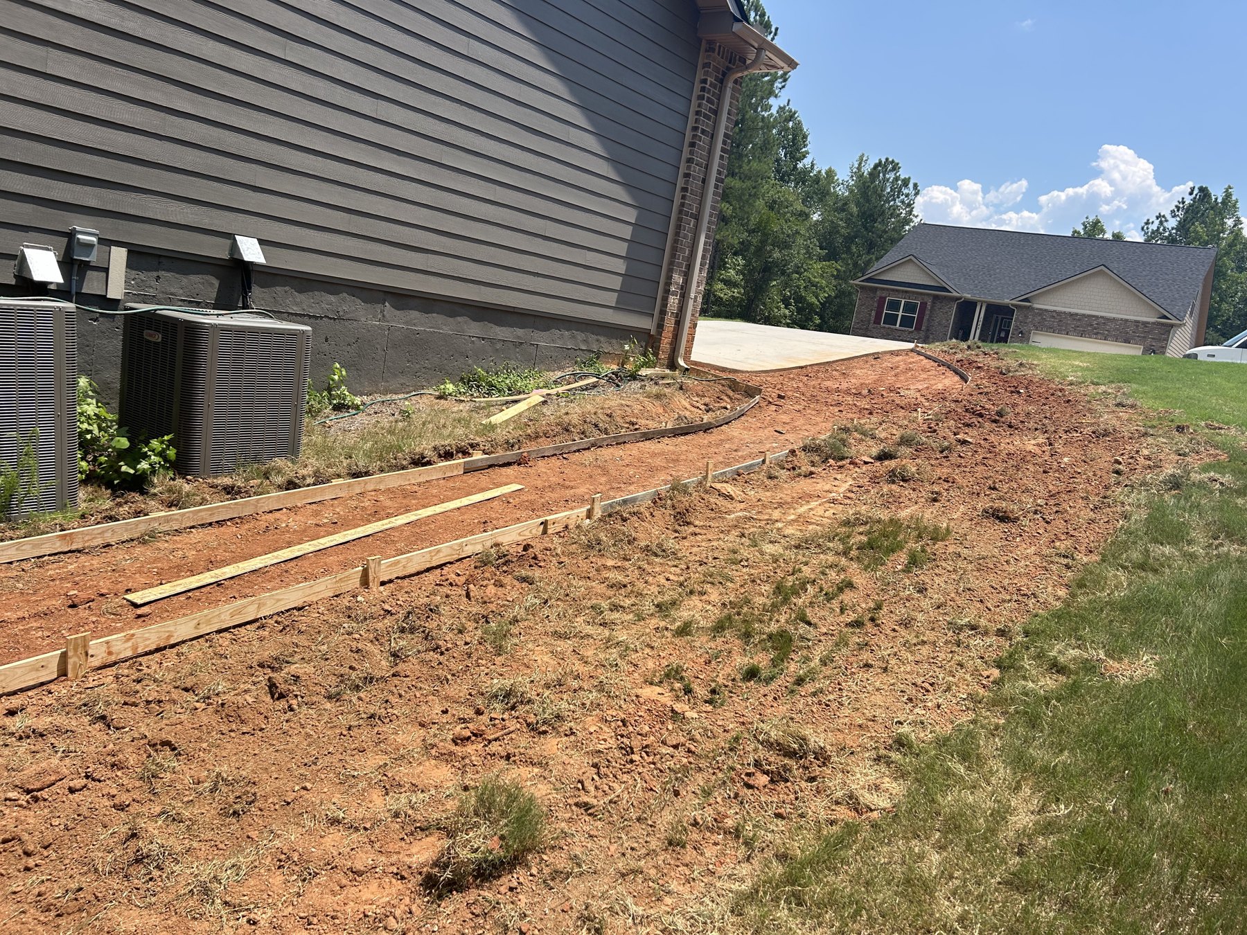 Garage walkway approach before concrete work photo 2 Garage walkway approach before photo 2 showing walkway concrete preparation by Colquitt Concrete in Georgia