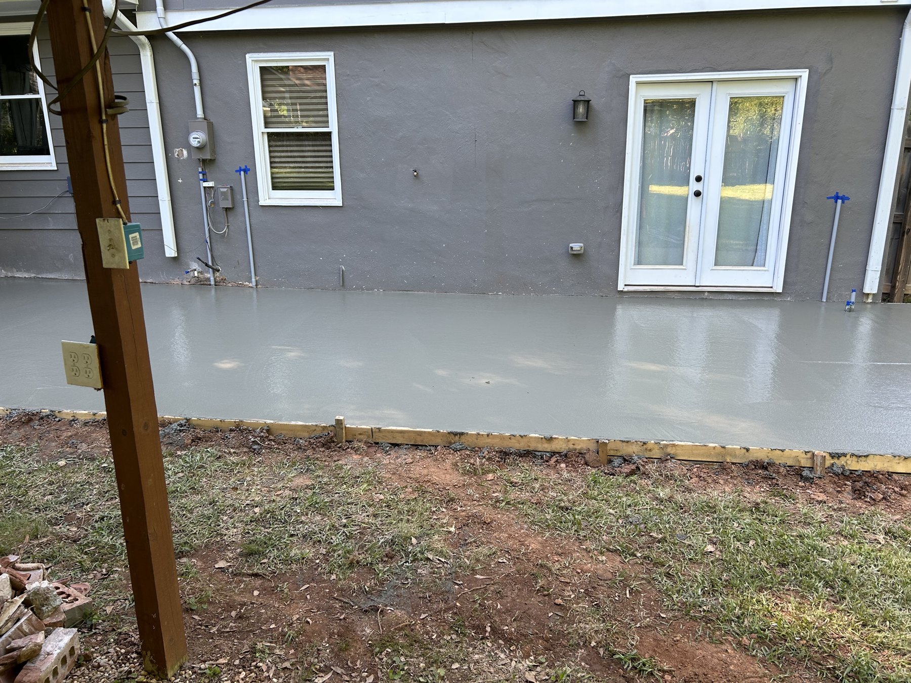 Rear patio and walk after photo 3 showing finished patio and walkway concrete work by Colquitt Concrete in Georgia
