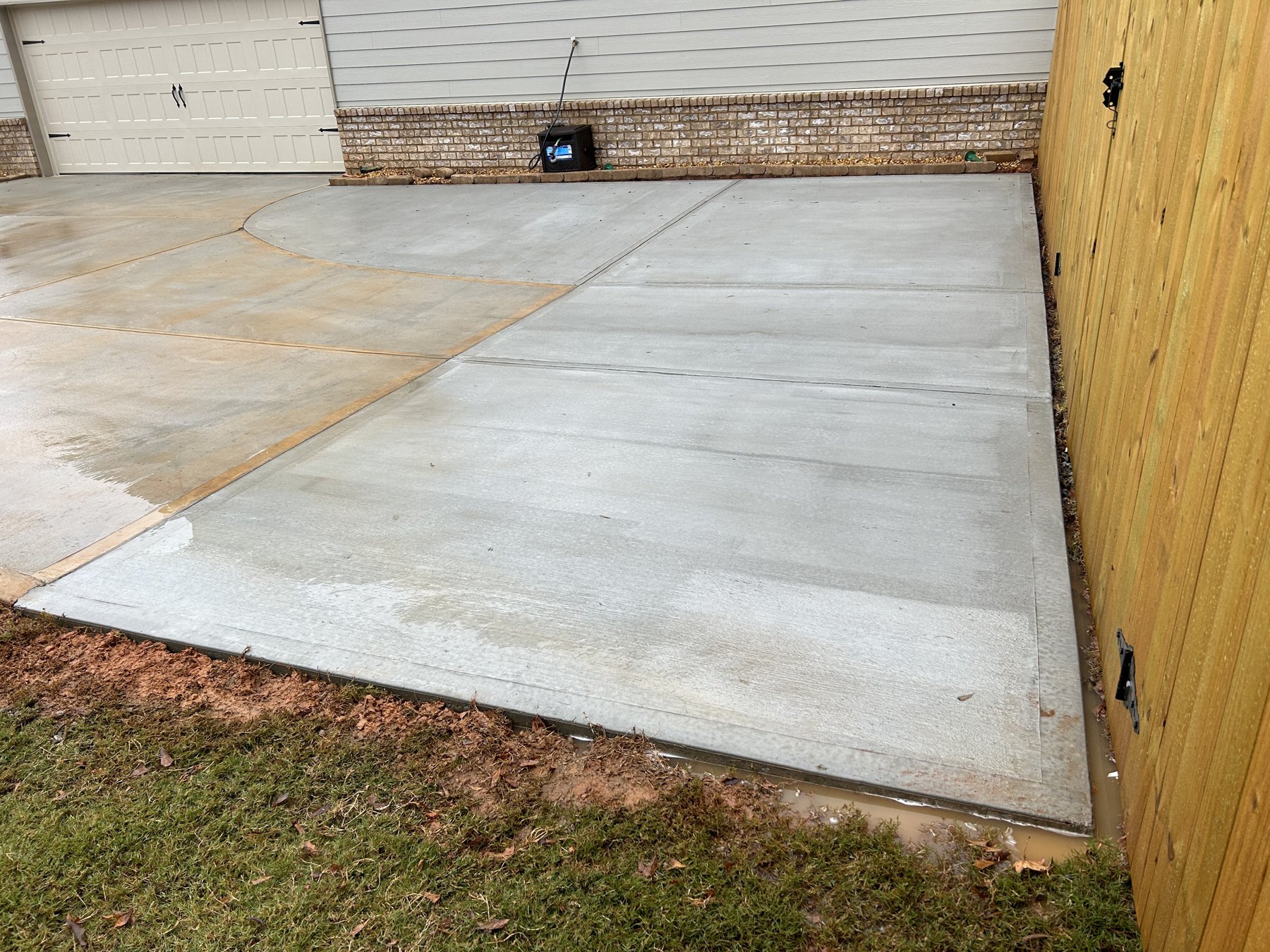 Side driveway extension finished concrete photo 3 Side driveway extension after photo 3 showing finished driveway concrete work by Colquitt Concrete in Georgia