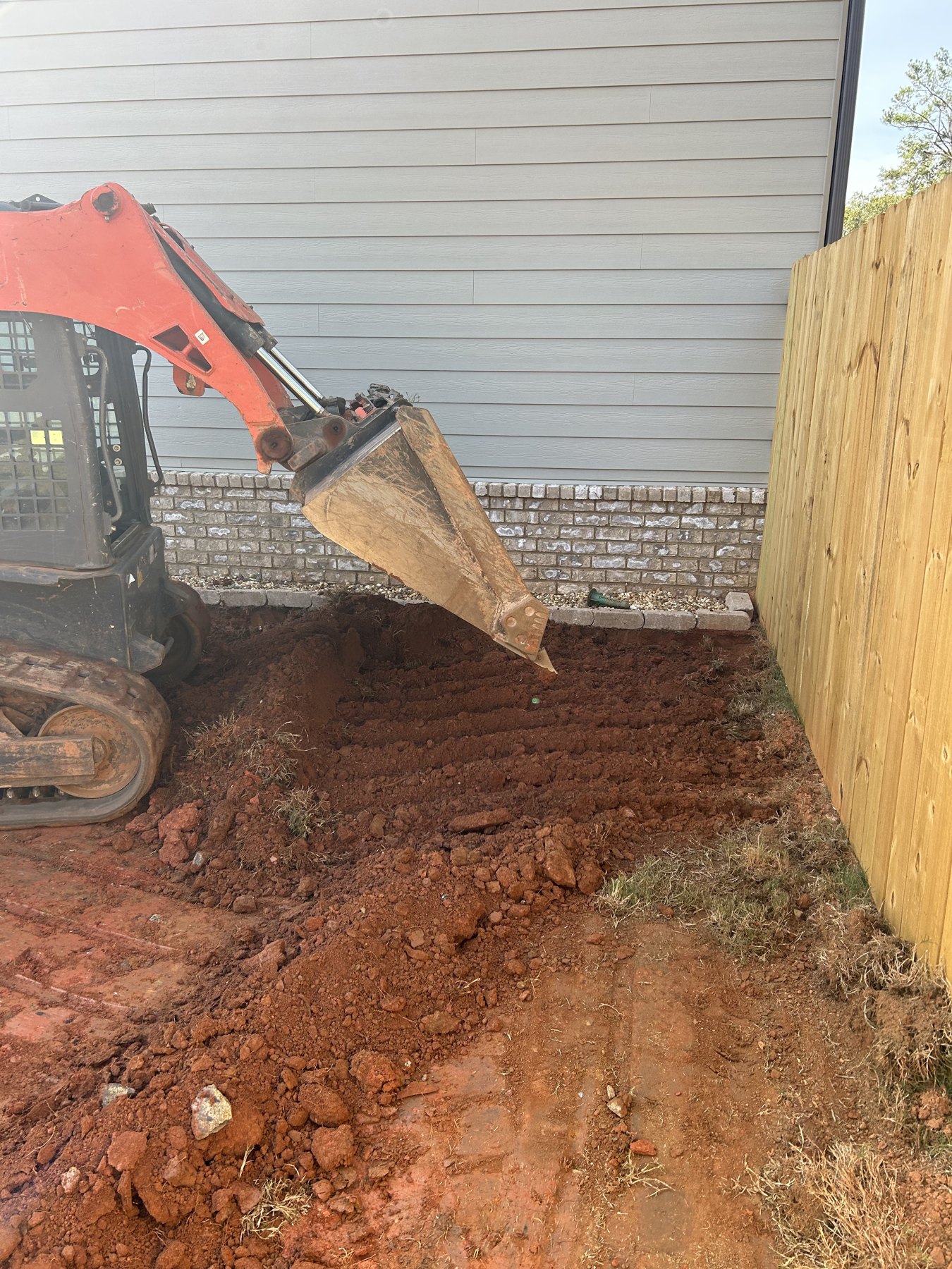 Side driveway extension before concrete work photo 2 Side driveway extension before photo 2 showing driveway concrete preparation by Colquitt Concrete in Georgia