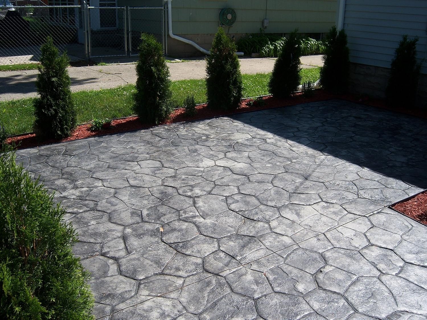 Stamped patio finish finished concrete photo 2 Stamped patio finish after photo 2 showing finished decorative concrete concrete work by Colquitt Concrete in Georgia
