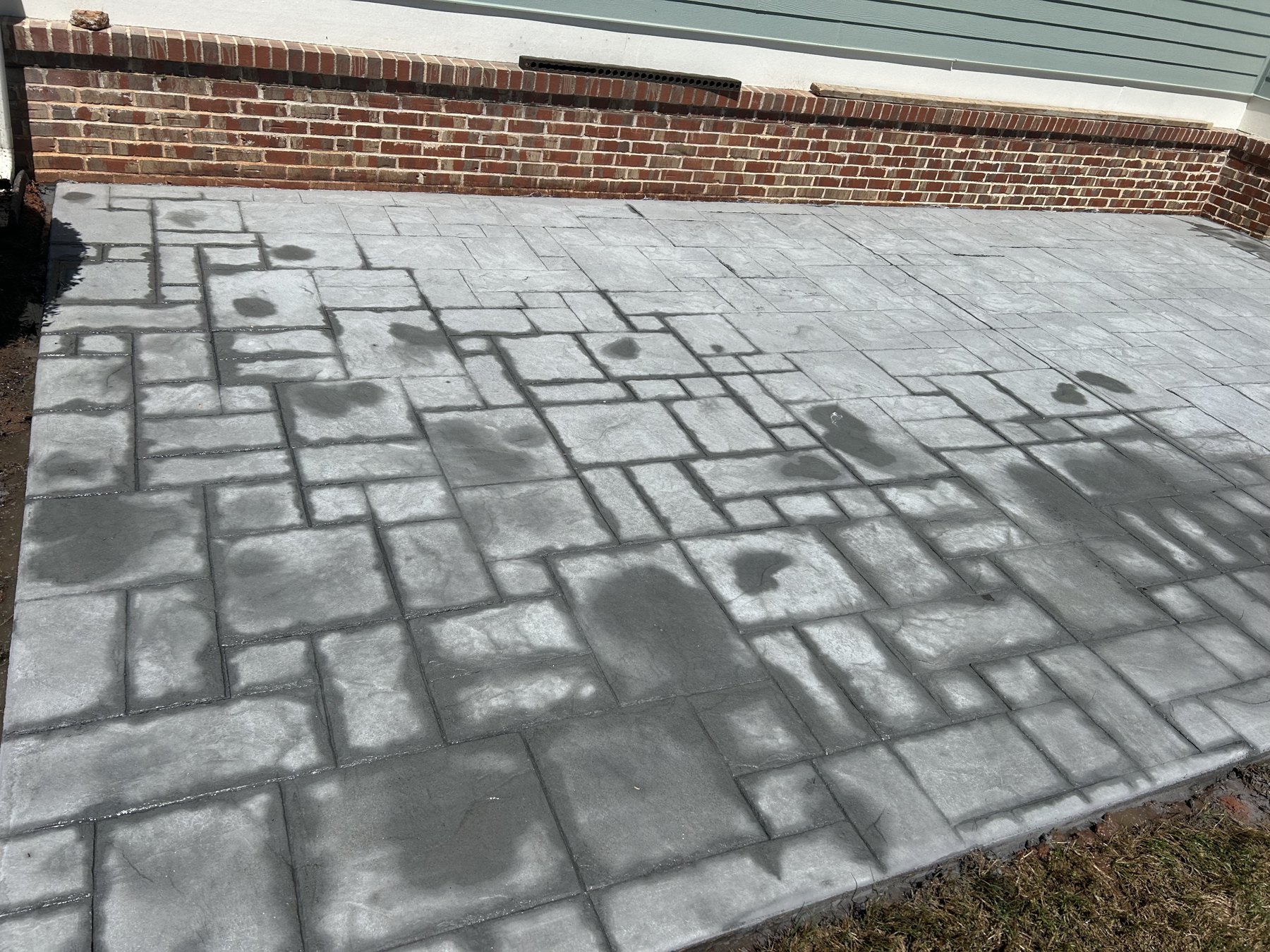 Stamped patio finish finished concrete photo 4 Stamped patio finish after photo 4 showing finished decorative concrete concrete work by Colquitt Concrete in Georgia